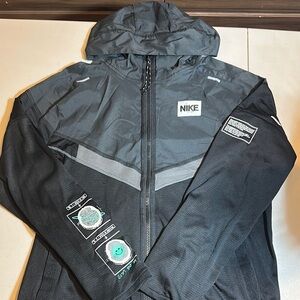 Used Nike Black and Gray Performance Jacket with Hood with pouch
